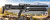 Karabinek Krait MK2 na tle gór.png